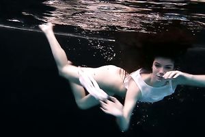 Skinny and tiny doxy underwater exposes her body