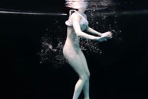 Skinny and tiny doxy underwater exposes her body