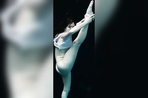 Skinny and tiny doxy underwater exposes her body