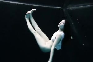 Skinny and tiny doxy underwater exposes her body
