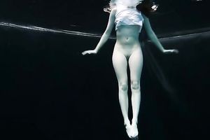 Skinny and tiny doxy underwater exposes her body