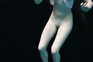 Skinny and tiny doxy underwater exposes her body