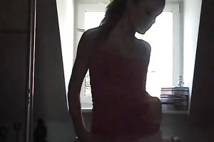 Cute golden-haired is striping and engulfing pole for a pov web camera