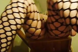 Blonde corpulent strumpet in hot fishnets pleases herself