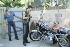 Blonde smutty honey with sunglasses feeding on a penis of a biker