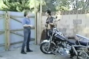 Blonde smutty honey with sunglasses feeding on a penis of a biker