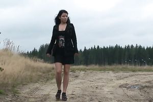 Brunette young white Russian housewife squats and piddles outdoors