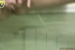 Perverted short haired skinny dark brown piddles onto the kitchen floor