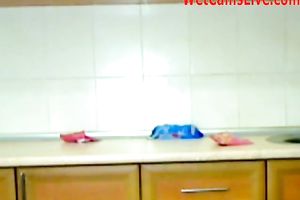 Two concupiscent camgirls are masturbating on the kitchen counter