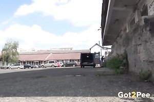 Sick dilettante dark brown in sunglasses urinates on the concrete steps