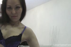 Brown-haired girl shows off her stripped body