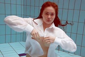 Sizzling hawt redhead legal age teenager takes off white shirt underwater