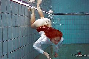 Sizzling hawt redhead legal age teenager takes off white shirt underwater
