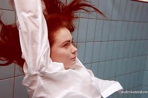 Sizzling hawt redhead legal age teenager takes off white shirt underwater