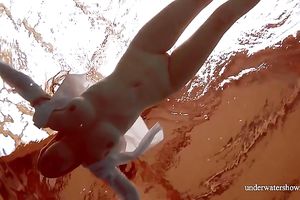 Sizzling hawt redhead legal age teenager takes off white shirt underwater