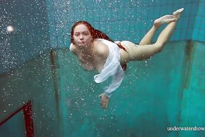 Sizzling hawt redhead legal age teenager takes off white shirt underwater
