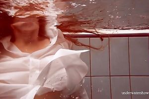 Sizzling hawt redhead legal age teenager takes off white shirt underwater