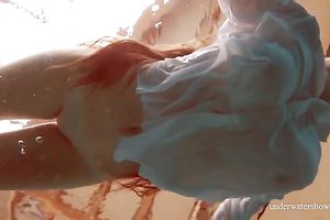 Sizzling hawt redhead legal age teenager takes off white shirt underwater