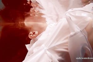 Sizzling hawt redhead legal age teenager takes off white shirt underwater