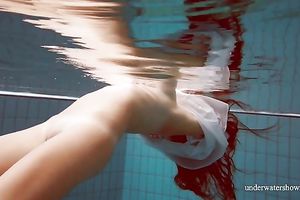 Sizzling hawt redhead legal age teenager takes off white shirt underwater