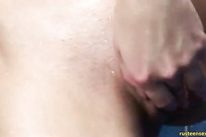 Flexible and sexy dark brown legal age teenager widens her legs in the air