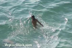 Sweet girlfriend and her guy were sunbathing nude on the beach