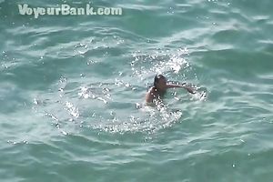 Sweet girlfriend and her guy were sunbathing nude on the beach