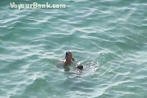 Sweet girlfriend and her guy were sunbathing nude on the beach