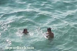 Sweet girlfriend and her guy were sunbathing nude on the beach