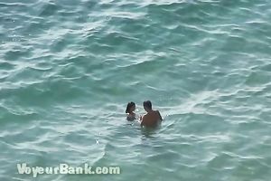 Sweet girlfriend and her guy were sunbathing nude on the beach