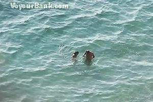 Sweet girlfriend and her guy were sunbathing nude on the beach