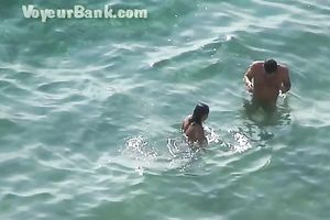 Sweet girlfriend and her guy were sunbathing nude on the beach