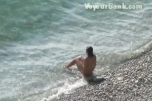 Sweet girlfriend and her guy were sunbathing nude on the beach