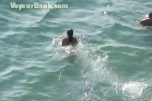 Sweet girlfriend and her guy were sunbathing nude on the beach