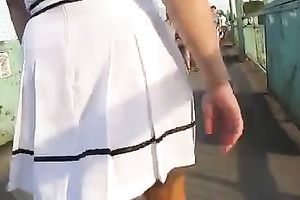 Following hawt slim hottie in short petticoat trying to watch her snatch