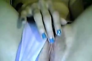 Brunette cam whore in T-shirt was busy with a delicate masturbation of her vagina