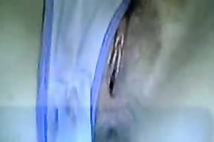 Brunette cam whore in T-shirt was busy with a delicate masturbation of her vagina