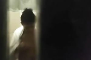 Spy livecam clip of quite skinny brunette taking a shower and drying herself