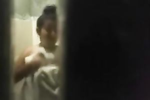 Spy livecam clip of quite skinny brunette taking a shower and drying herself