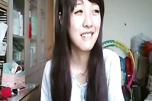 Long-haired Asian sweetheart flashes her pants for the web camera