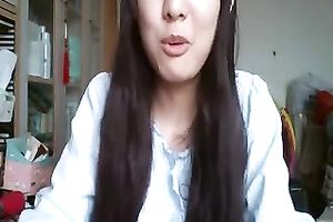 Long-haired Asian sweetheart flashes her pants for the web camera