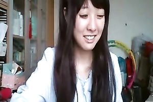 Long-haired Asian sweetheart flashes her pants for the web camera