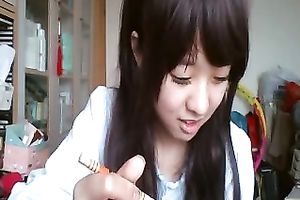 Long-haired Asian sweetheart flashes her pants for the web camera