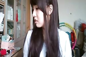 Long-haired Asian sweetheart flashes her pants for the web camera