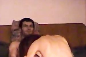 Red haired chick riding solid rod in a cowgirl position