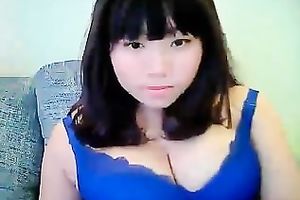 Cute dilettante dark brown Asian model girl on cam teases me with her tits