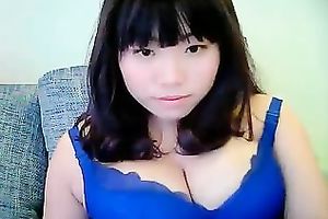 Cute dilettante dark brown Asian model girl on cam teases me with her tits