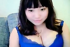 Cute dilettante dark brown Asian model girl on cam teases me with her tits