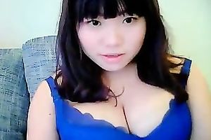 Cute dilettante dark brown Asian model girl on cam teases me with her tits
