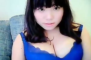 Cute dilettante dark brown Asian model girl on cam teases me with her tits